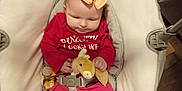 Charlotte Elishka is registered to the contest to win money with this photo: baby, baby_rocker, bow, child, comfort, cushion, cute, expression, flooring, hand, headband, indoor, infant, person, plush_toy, red_clothing, seat_belt, small, toy, wood_floor