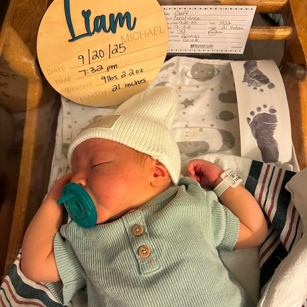 Liam joined the competition — help win amazing prizes! baby, baby_bed, bed, blanket, clothing, crib, cute, footprints, hat, hospital, hospital_bracelet, hospital_room, infant, newborn, pacifier, portrait, resting, sleeping, swaddled, wooden_sign