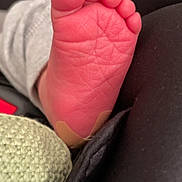 Liam joined the competition — help win amazing prizes! baby, baby_foot, bandage, black_fabric, close_up, cute, detail, footwear, human, infant, knitted_fabric, limb, newborn, pink_skin, resting, skin, small, soft_texture, toes, wrinkles