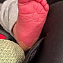 baby, baby_foot, bandage, black_fabric, close_up, cute, detail, footwear, human, infant, knitted_fabric, limb, newborn, pink_skin, resting, skin, small, soft_texture, toes, wrinkles