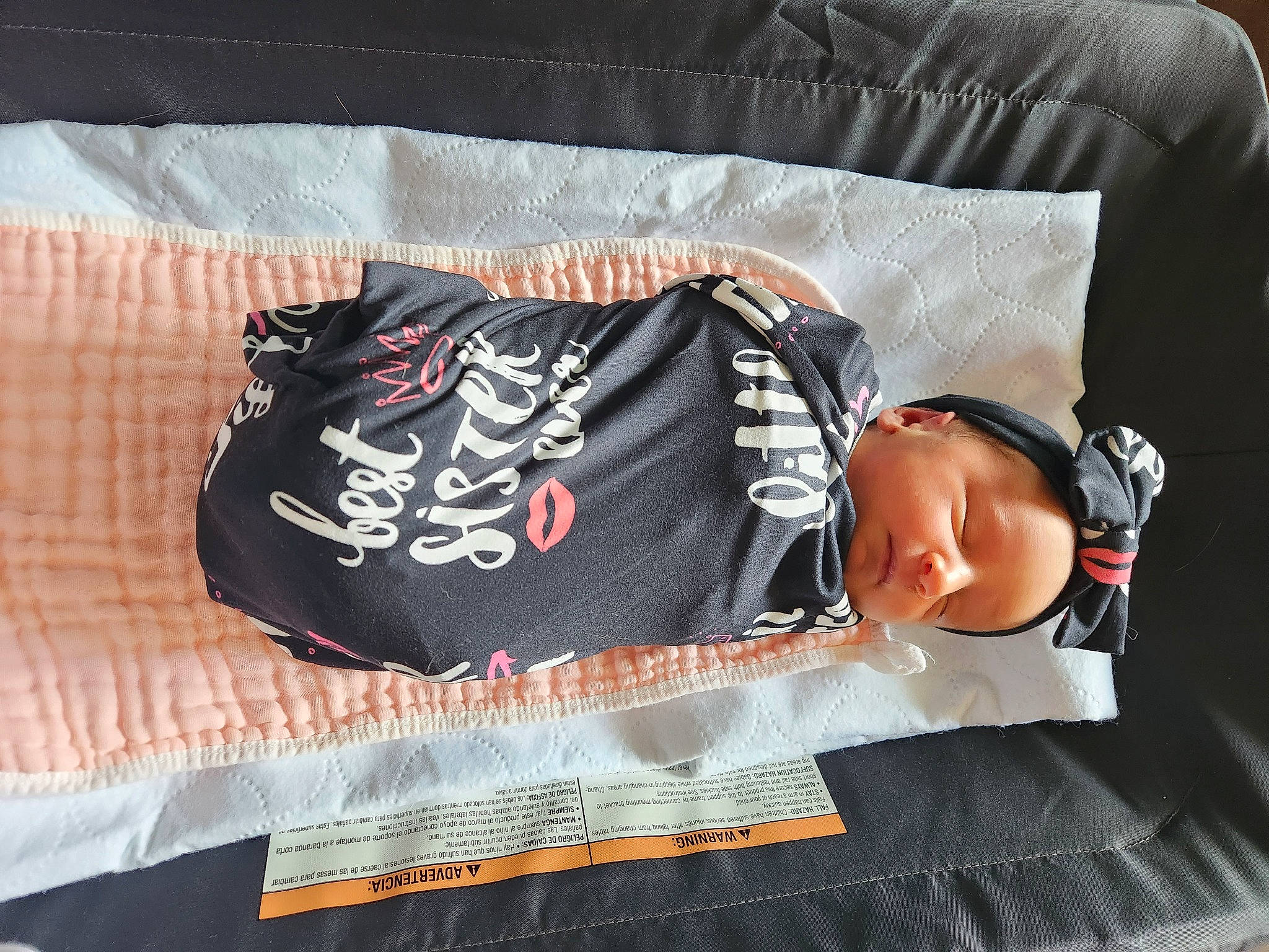 Abigail is registered to the contest to win money with this photo: baby, baby_toddler_clothing, comfort, comfort_food, font, linens, orange, pattern, person, product, sleeve, t_shirt, textile, toddler