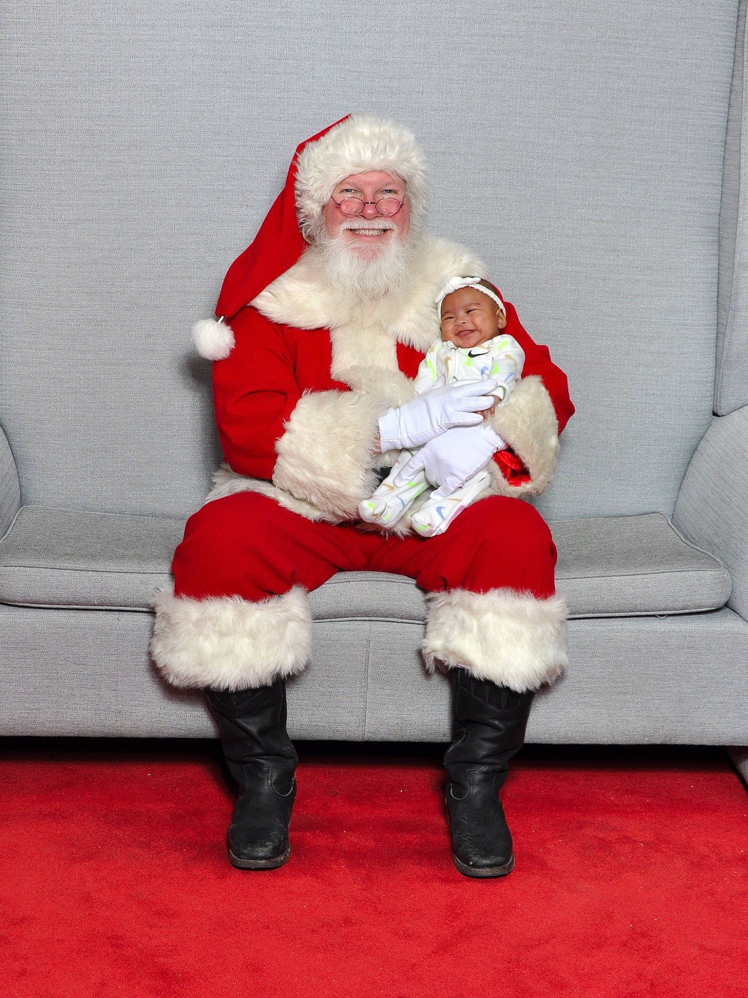 Katherine joined the competition — help win amazing prizes! beard, boot, christmas, comfort, costume_hat, event, eye, facial_hair, fictional_character, fur, happy, hat, headwear, holiday, joy, knee, lap, leg, person, santa_claus