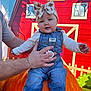 baby, child, infant, denim_overalls, bow_headband, pumpkin, hand, adult, barn, red_background, outdoor, fall, autumn, cute, smiling, portrait, clothing, person, seasonal, festival