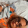 Paisley is registered to the contest to win money with this photo: newborn, baby, woman, hospital_bed, blanket, pacifier, glasses, bed, medical_equipment, resting, patient, mother, skin, striped_hat, closeup, indoor, person, healthcare, comfort, intimacy