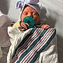 newborn, baby, pacifier, bow_hat, blanket, hospital_bed, sleeping, infant, striped_blanket, wrapped, toddler, child, person, sleep, cute, small_hands, pink_blue, soft, resting, indoors