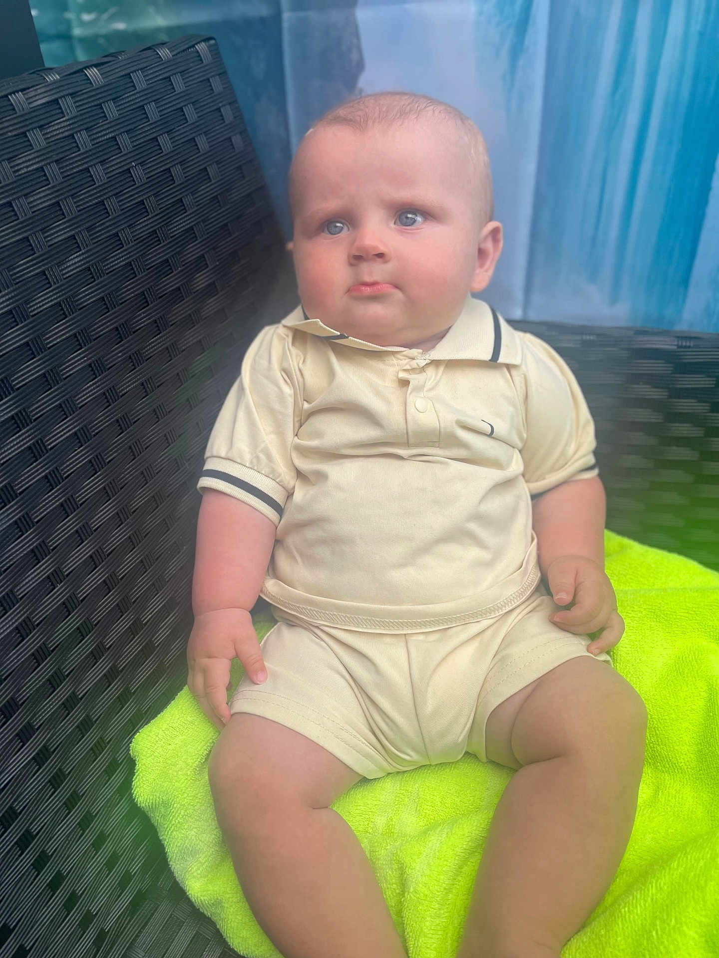 Alex-William joined the competition — help win amazing prizes! baby, blue_eyes, child, chubby, clothing, cute, expression, furniture, indoor, infant, neon_green, person, portrait, shirt, shorts, sitting, skin, towel, wicker_chair, young