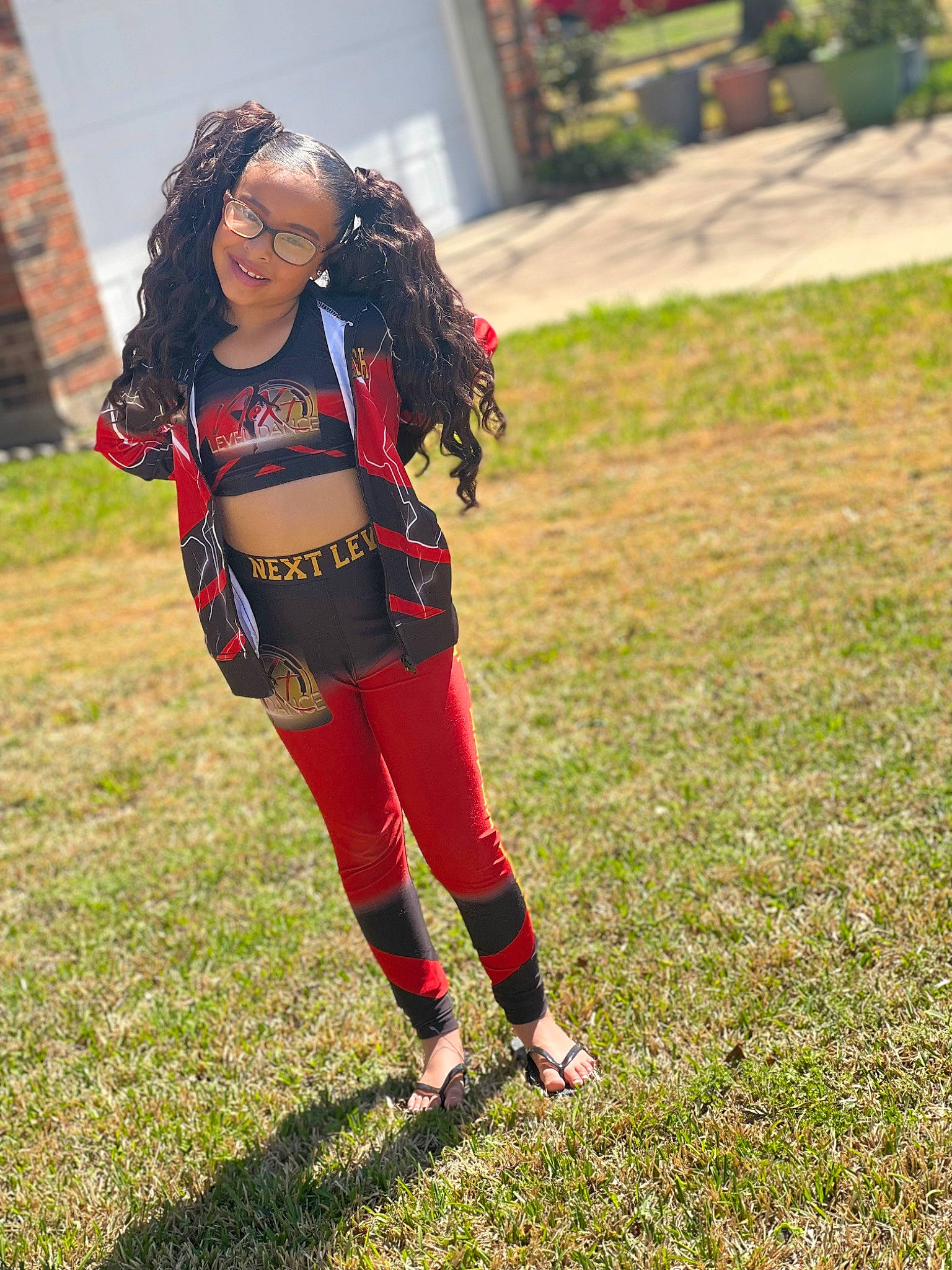 Rhyleigh is registered to the contest to win money with this photo: boot, event, eyewear, face, fictional_character, fun, glove, grass, grassland, happy, human_leg, jewellery, joy, leisure, luggage_and_bags, person, personal_protective_equipment, recreation, smile, sportswear