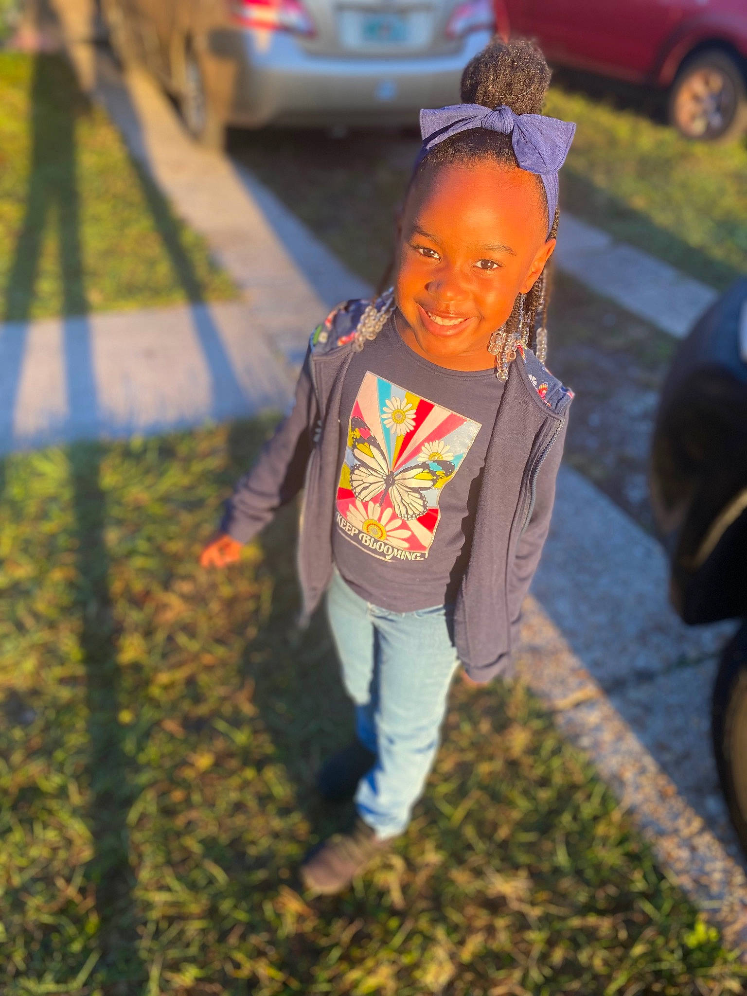 Samani joined the competition — help win amazing prizes! asphalt, automotive_exterior, automotive_lighting, car, city, family_car, fun, grass, happy, joy, leisure, light, person, plant, recreation, road, sidewalk, smile, toddler, tree