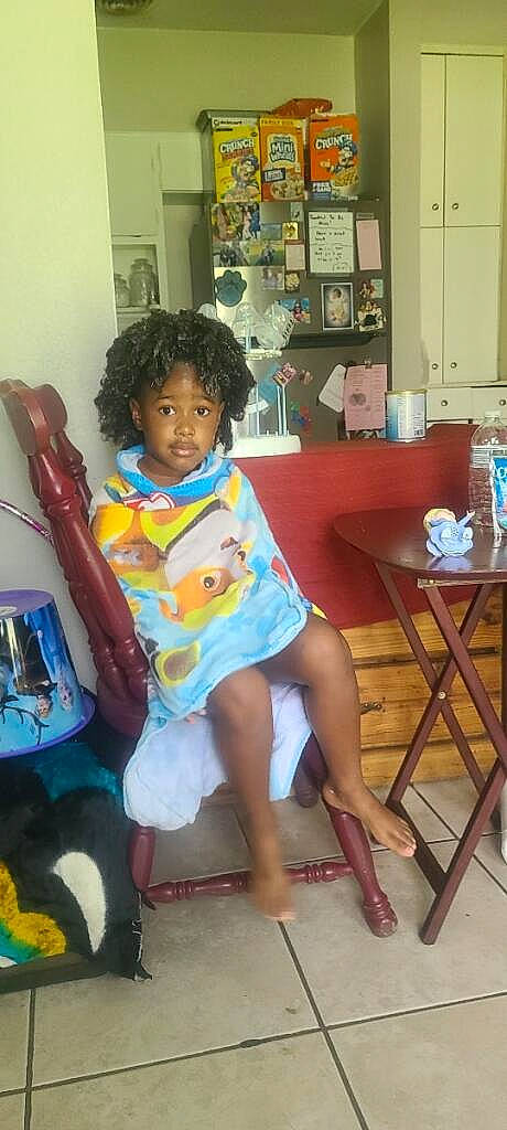 Samani joined the competition — help win amazing prizes! chair, child, foot, fun, happy, human_leg, knee, leisure, magenta, musical_instrument, person, picture_frame, play, room, sandal, shorts, sitting, t_shirt, table, thigh