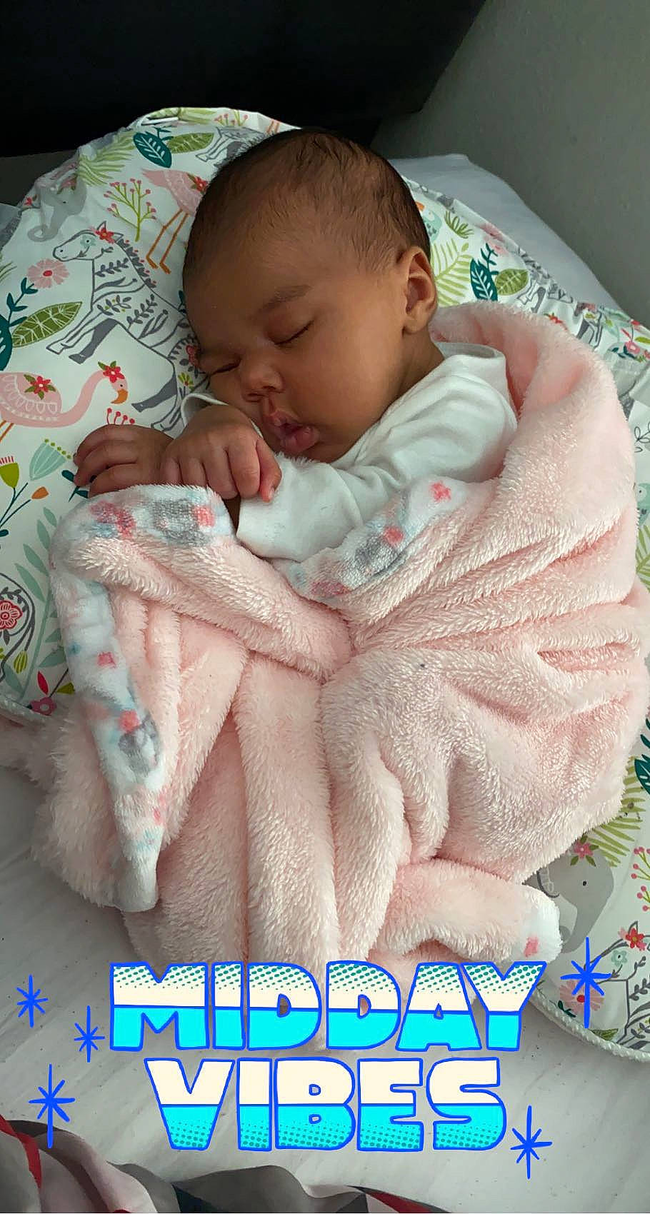 Zola is registered to the contest to win money with this photo: baby, baby_products, baby_sleeping, baby_toddler_clothing, bedding, bedtime, cheek, child, comfort, finger, flesh, linens, mouth, pattern, person, photo_caption, pink, product, skin, thumb