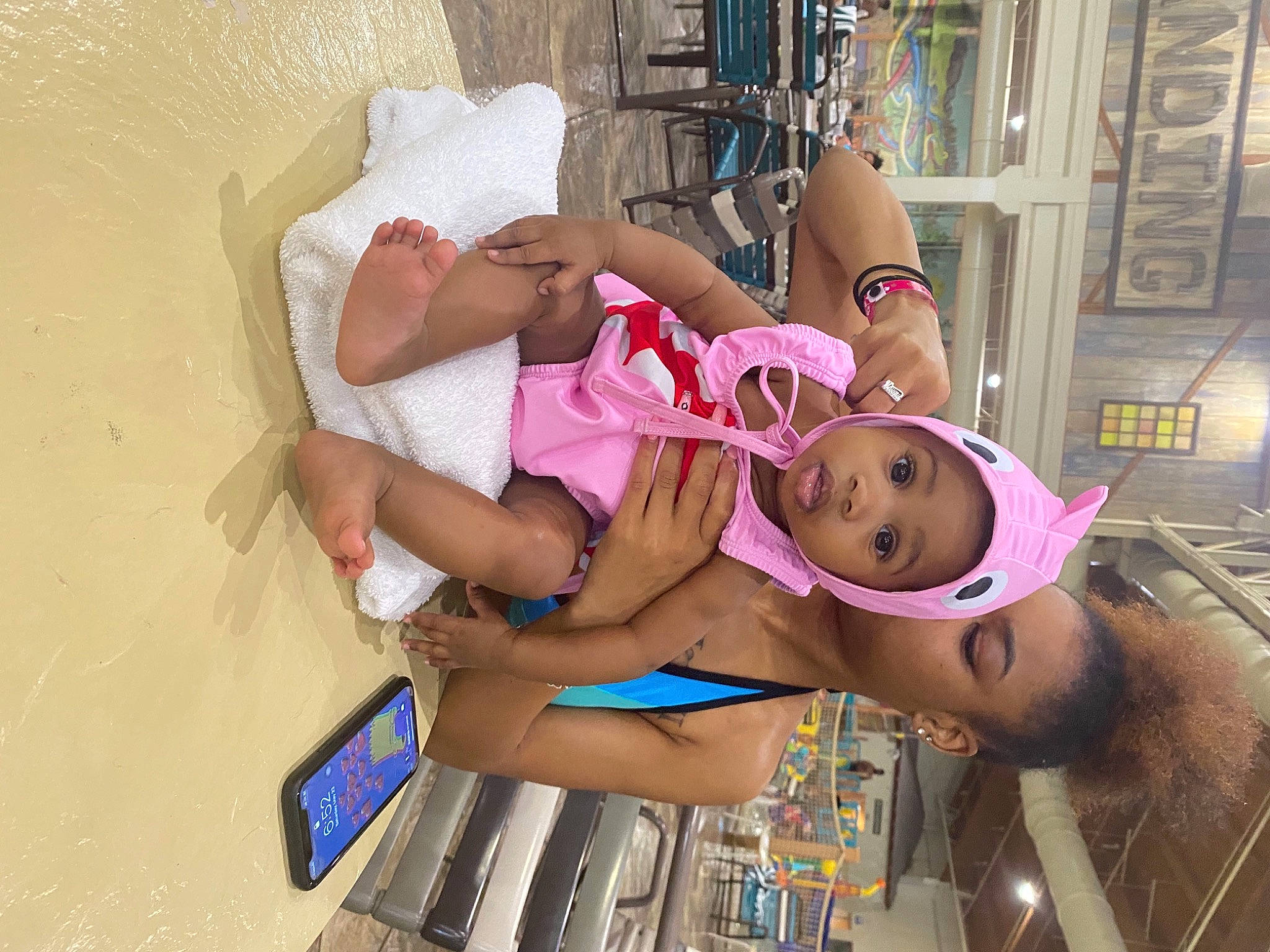 Amiya is registered to the contest to win money with this photo: abdomen, chest, eyelash, foot, fun, human_leg, knee, leisure, lingerie, mobile_phone, mouth, person, portable_communications_device, room, sandal, shorts, swimwear, thigh, toddler, trunk