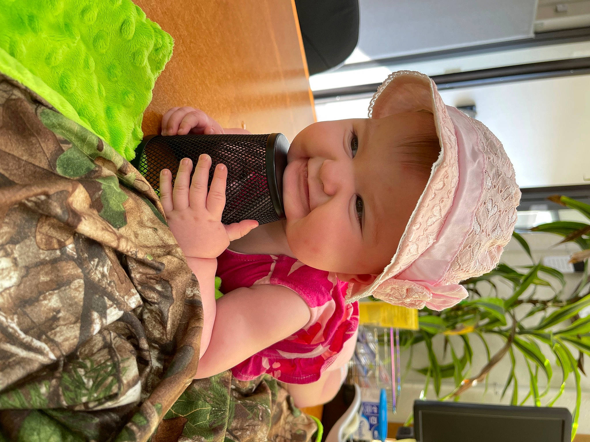 Emma is registered to the contest to win money with this photo: army, baby, baby_toddler_clothing, camouflage, child, fashion_accessory, fun, gesture, grass, happy, hat, headwear, marines, military_camouflage, military_uniform, non_commissioned_officer, pattern, person, plant, sleeve