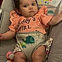 Remington joined the competition — help win amazing prizes! baby, infant, child, baby_seat, pacifier, clothing, toddler, cute, indoor, colorful, animal_print, rainbow, baby_girl, serious_expression, soft_lighting, fabric, toy, seat, comfort, portrait