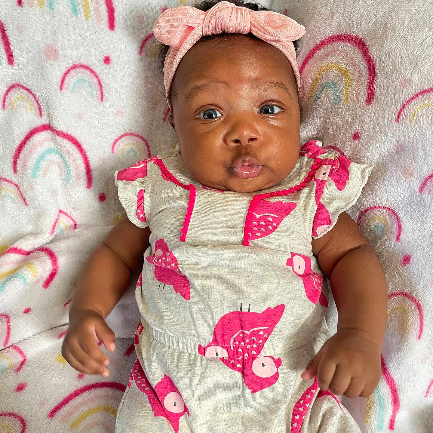 Demi joined the competition — help win amazing prizes! applique, baby, bodypart, bonnet, clothing, dress, face, finger, hand, happy, hat, head, newborn, pattern, person, photography, portrait, sitting, smile, t_shirt