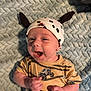 Ziah is registered to the contest to win money with this photo: baby, blue_blanket, child, clothing, cute, expression, face, hands, happy, hat, headwear, indoor, infant, lying_down, monster_truck, onesie, pattern, playful, smile, soft_texture