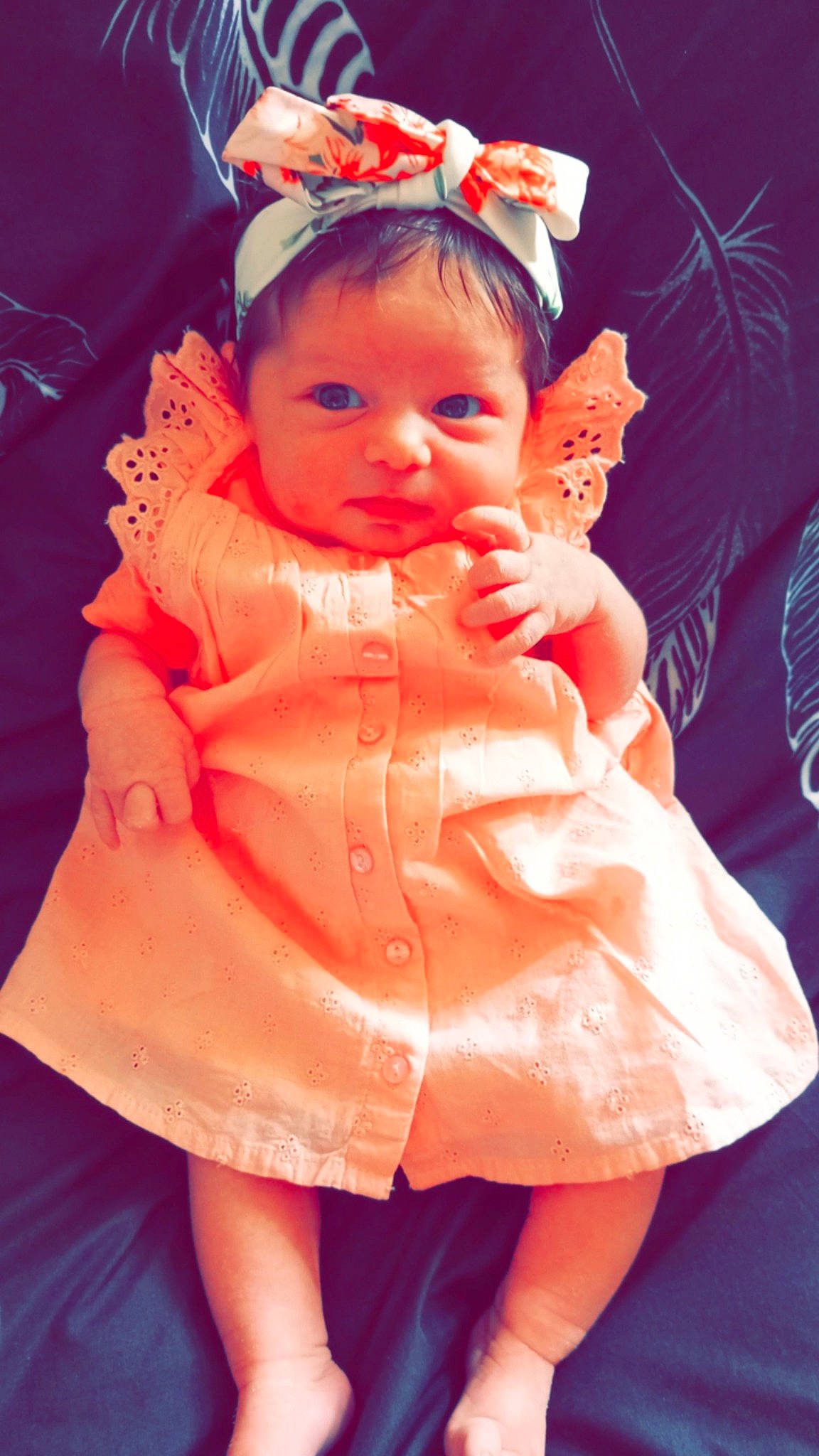 Mia participe au concours pour gagner de l'argent avec cette photo : baby, baby_toddler_clothing, dress, event, eyelash, finger, fun, gesture, happy, headpiece, human_leg, lip, orange, peach, person, pink, skin, sleeve, smile, thumb