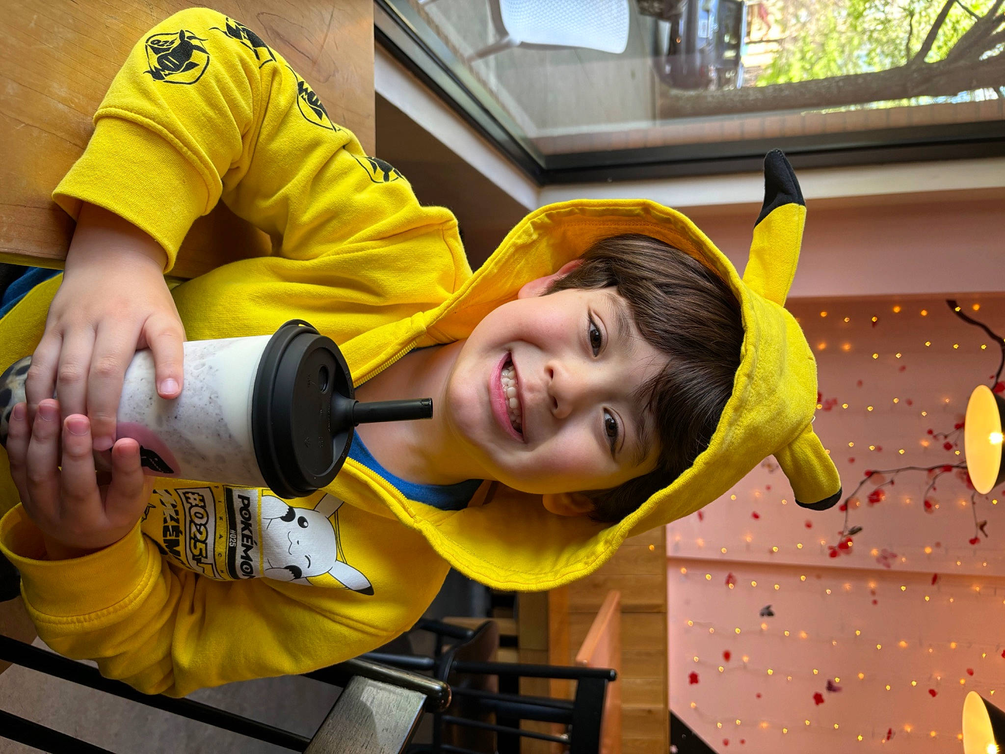 Angelo is registered to the contest to win money with this photo: child, event, fun, happy, joy, leisure, orange, person, play, recreation, room, smile, t_shirt, toddler, window, yellow