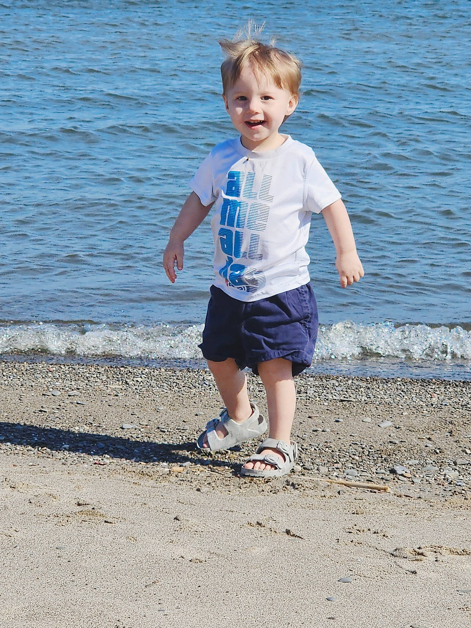 Jaxon joined the competition — help win amazing prizes! azure, beach, child, coastal_and_oceanic_landforms, electric_blue, fun, happy, joy, lake, leg, leisure, people_in_nature, people_on_beach, person, sand, shore, shorts, sleeve, t_shirt, toddler