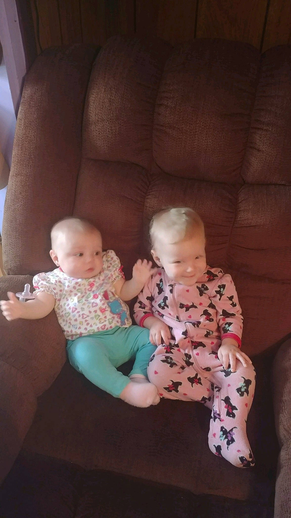 Rebecca is registered to the contest to win money with this photo: baby, baby_toddler_clothing, cheek, comfort, eye, face, finger, floor, flooring, head, human_body, interaction, iris, joint, lap, leg, person, shoulder, skin, sleeve