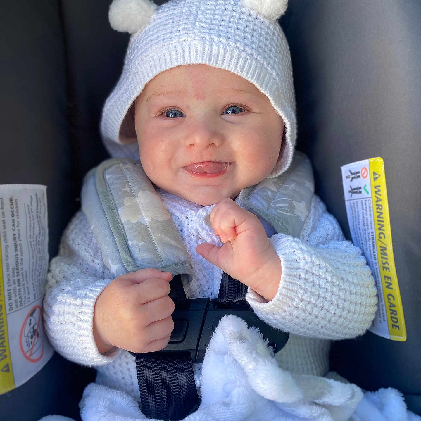 Oaklyn joined the competition — help win amazing prizes! baby, bodypart, bonnet, cap, clothing, coat, face, finger, furniture, glove, hand, happy, hat, head, jacket, newborn, person, photography, portrait, smile