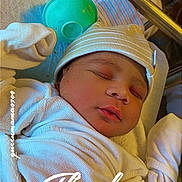 Danny joined the competition — help win amazing prizes! newborn, baby, sleeping, infant, blanket, hat, clothing, hospital, bottle, face, peaceful, portrait, resting, closeup, soft, cute, child, person, bed, warm