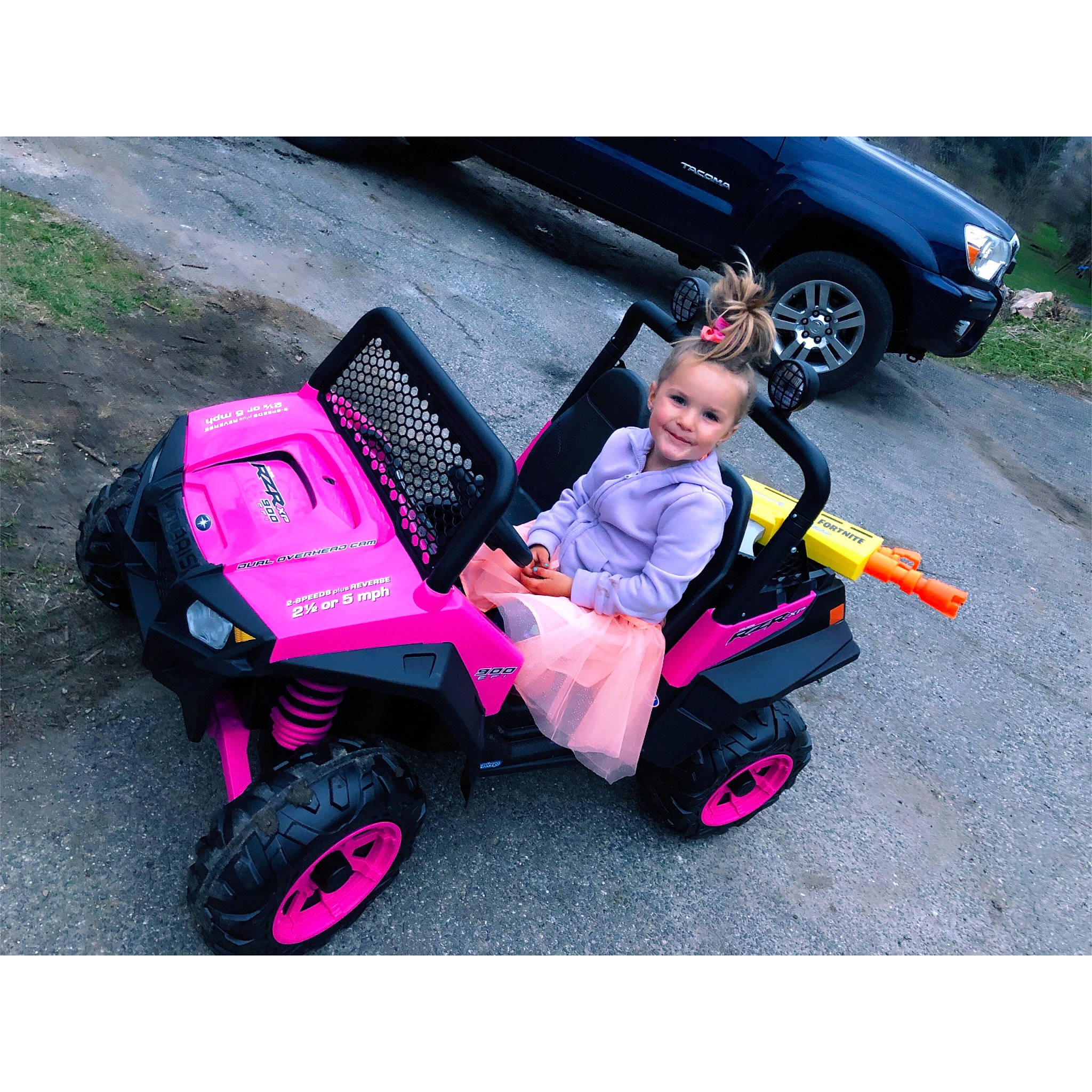 Emma is registered to the contest to win money with this photo: automotive_design, automotive_exterior, automotive_tire, automotive_wheel_system, baby_carriage, car, fender, joy, mode_of_transport, motor_vehicle, person, pink, plant, product, riding_toy, rolling, shoe, tire, toddler, toy