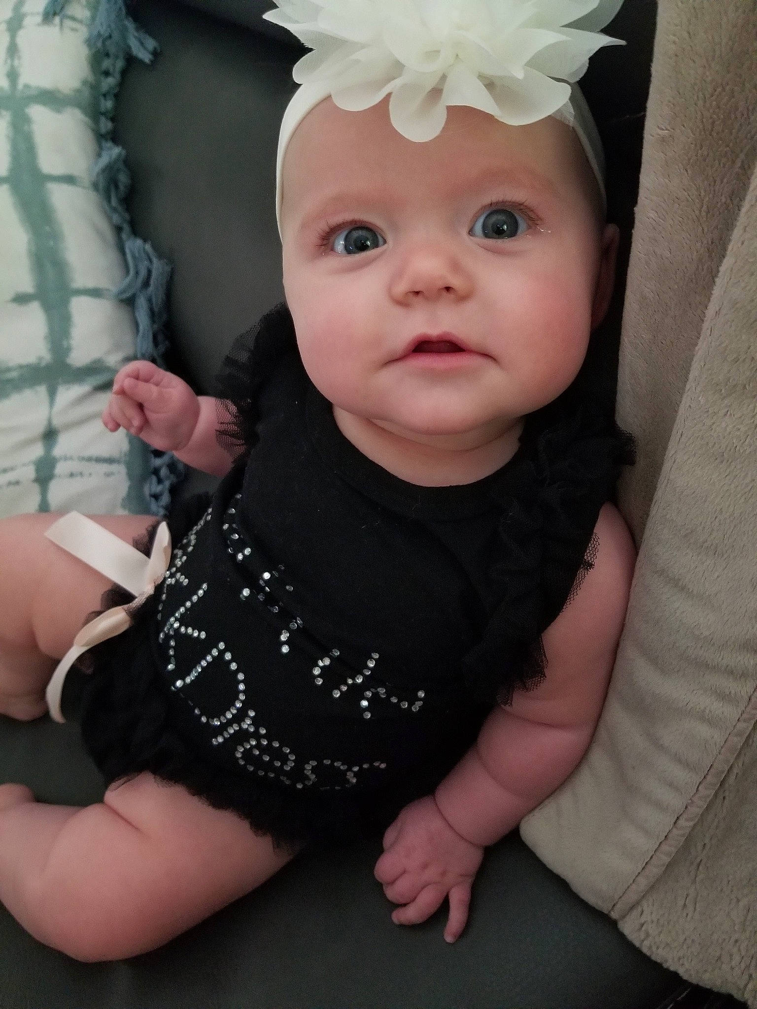 Ryliegh is registered to the contest to win money with this photo: arm, baby, baby_products, baby_toddler_clothing, cheek, child, costume_accessory, eye, face, fashion_accessory, finger, hair_accessory, hand, head, headgear, person, pink, product, skin, toddler