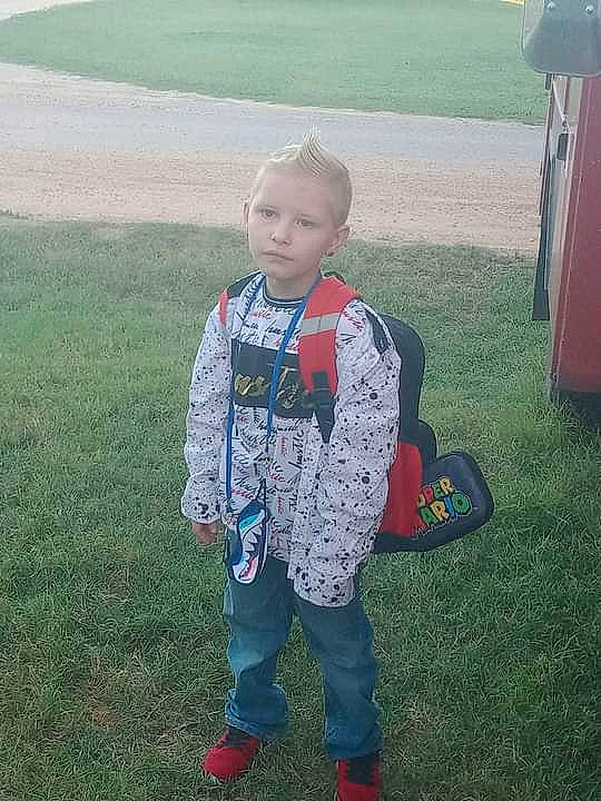 Dalton joined the competition — help win amazing prizes! child, cool, electric_blue, fun, grass, grassland, head, landscape, lawn, leisure, pattern, people_in_nature, person, personal_protective_equipment, play, recreation, sitting, sleeve, soil, t_shirt