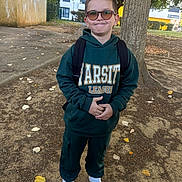 Lucas a rejoint le concours — aidez-le/la à gagner de superbes lots ! child, boy, outdoor, tree, backpack, sunglasses, hoodie, sweatpants, white_shoes, autumn, leaves, sidewalk, smile, standing, casual_clothing, young, playful, ground, person, nature