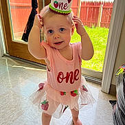 Riyah is registered to the contest to win money with this photo: accessories, adult, baby, clothing, costume, crown, door, dress, face, female, hat, head, jewelry, partyhat, person, photography, portrait, skirt, woman, wood