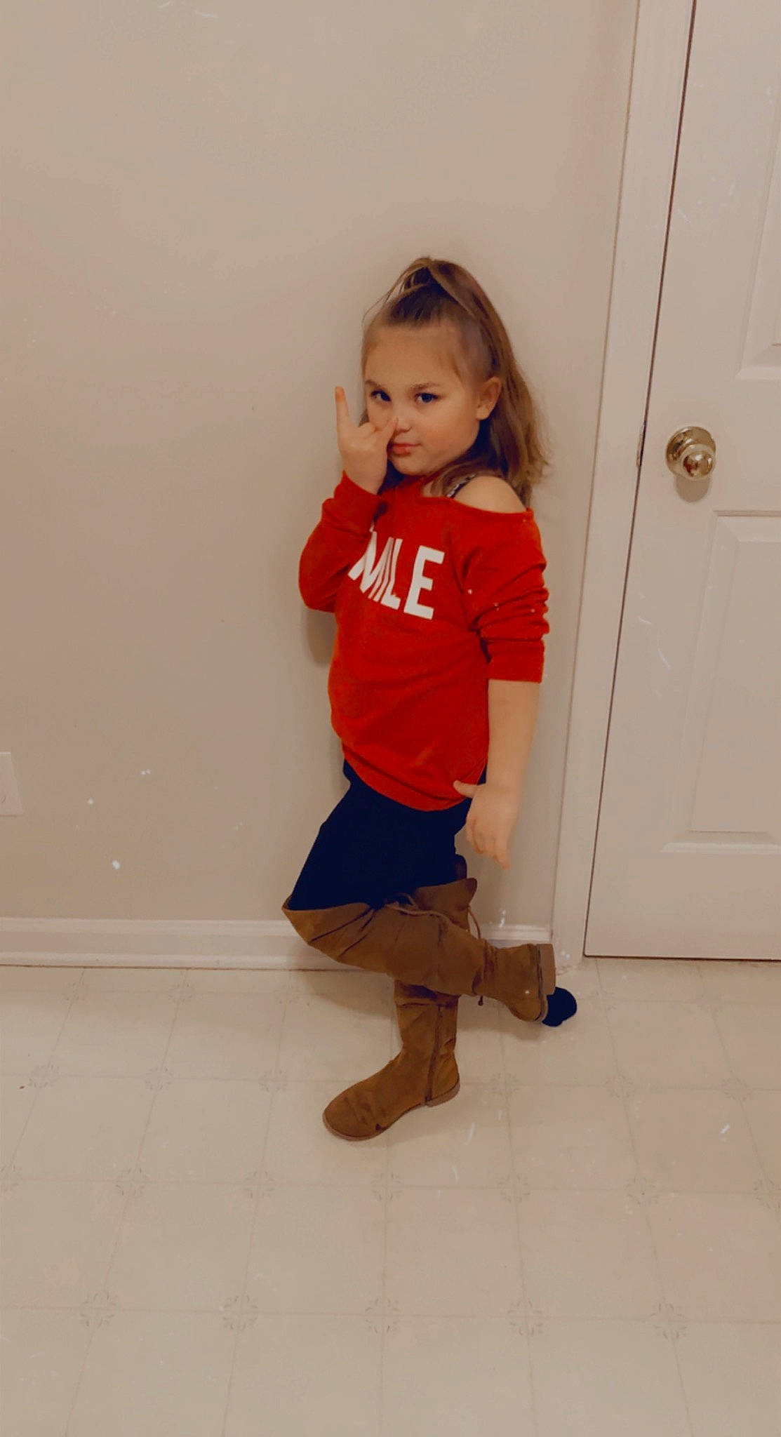 Amora is registered to the contest to win money with this photo: arm, baby_toddler_clothing, door, fashion_design, floor, flooring, hair, human_body, human_leg, joint, knee, neck, person, shoulder, sleeve, sock, t_shirt, thigh, toddler, trunk