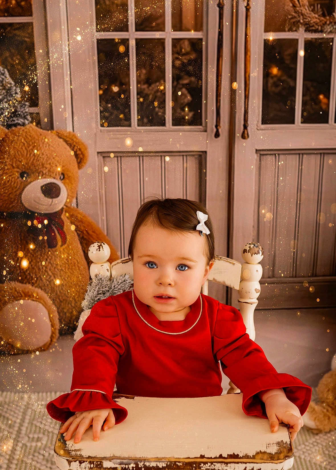 Ella Rose is registered to the contest to win money with this photo: child, toddler, red_dress, white_bow, blue_eyes, sitting, wooden_chair, teddy_bear, stuffed_animal, winter_decor, festive, indoors, portrait, cute, holiday, sparkles, cozy, decor, curious, face