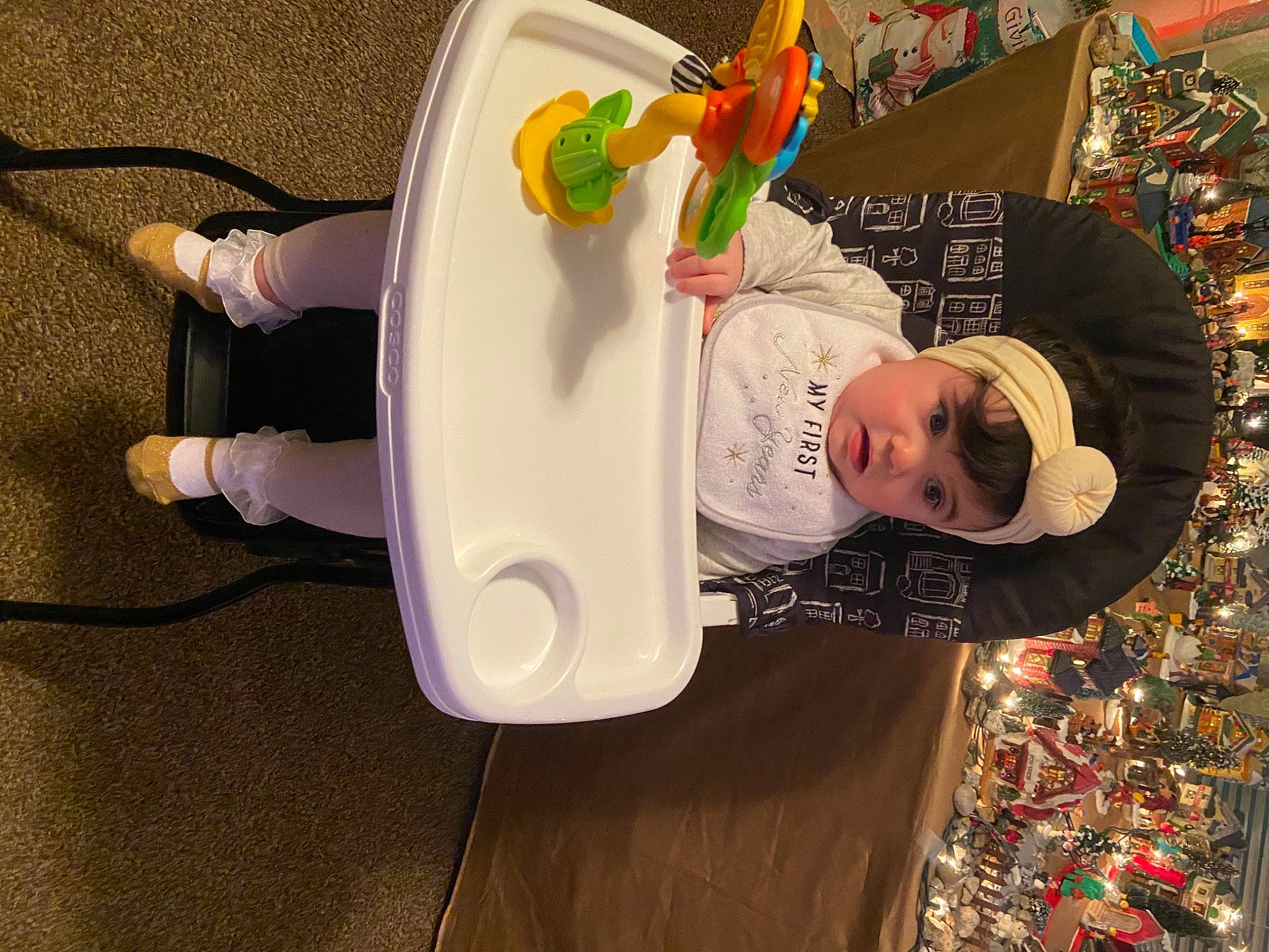 Alexandria is registered to the contest to win money with this photo: animation, audio_equipment, baby_toys, cap, child, event, flooring, fun, happy, hat, headwear, party_supply, person, play, room, shelf, stuffed_toy, sun_hat, t_shirt, toddler