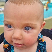 Mila participe au concours pour gagner de l'argent avec cette photo : baby, child, blue_eyes, close_up, curious, face, infant, outdoor, pool, swimwear, tropical_pattern, portrait, skin, head, person, young, summer, vacation, water, daylight