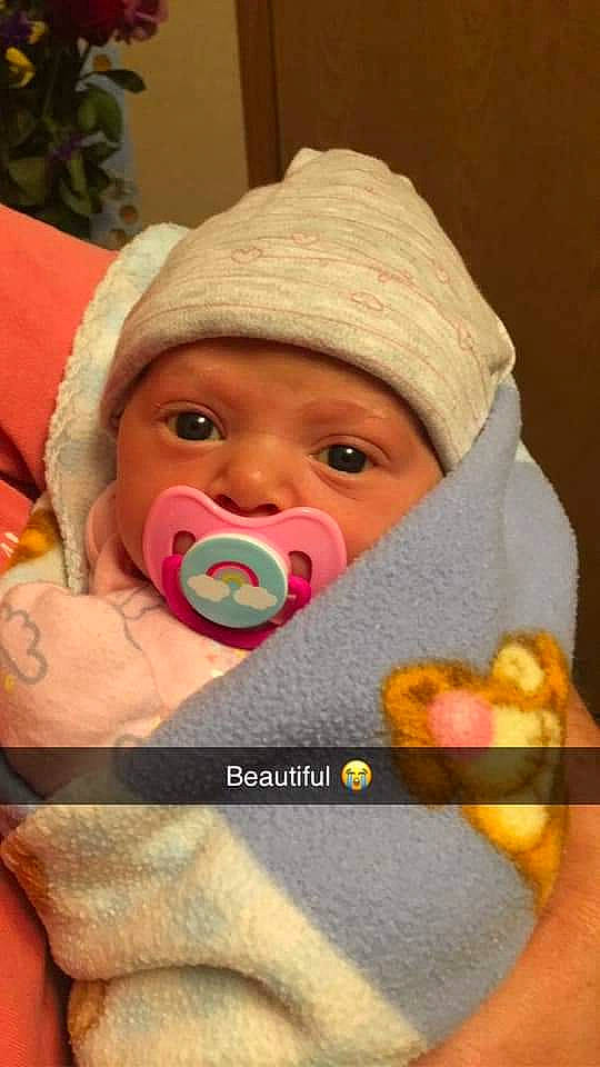 Kynlee is registered to the contest to win money with this photo: baby, baby_toddler_clothing, cheek, chin, comfort, eye, eyebrow, eyelash, face, facial_expression, head, headgear, headwear, iris, lip, mouth, nose, outerwear, person, product