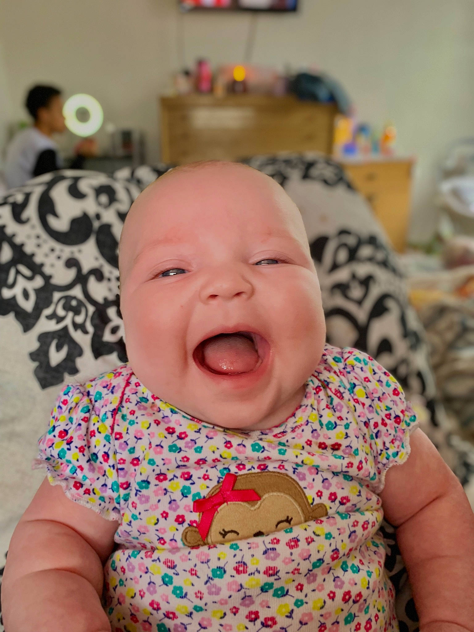 Remi joined the competition — help win amazing prizes! baby, baby_toddler_clothing, cheek, child, chin, comfort, dress, event, eye, face, facial_expression, fun, happy, iris, mouth, nose, person, skin, smile, textile