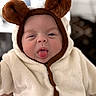 Israa a rejoint le concours — aidez-le/la à gagner de superbes lots ! baby, infant, child, costume, bear_ears, hood, cute, tongue_out, playful, soft_texture, warm_clothing, portrait, face, expression, indoors, adorable, winking, fuzzy, closeup, young