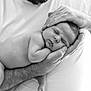 Sandro participe au concours pour gagner de l'argent avec cette photo : baby, sleeping, hands, adult, black_and_white, portrait, peaceful, newborn, skin, closeup, tenderness, parent, love, family, monochrome, rest, infant, care, comfort, holding