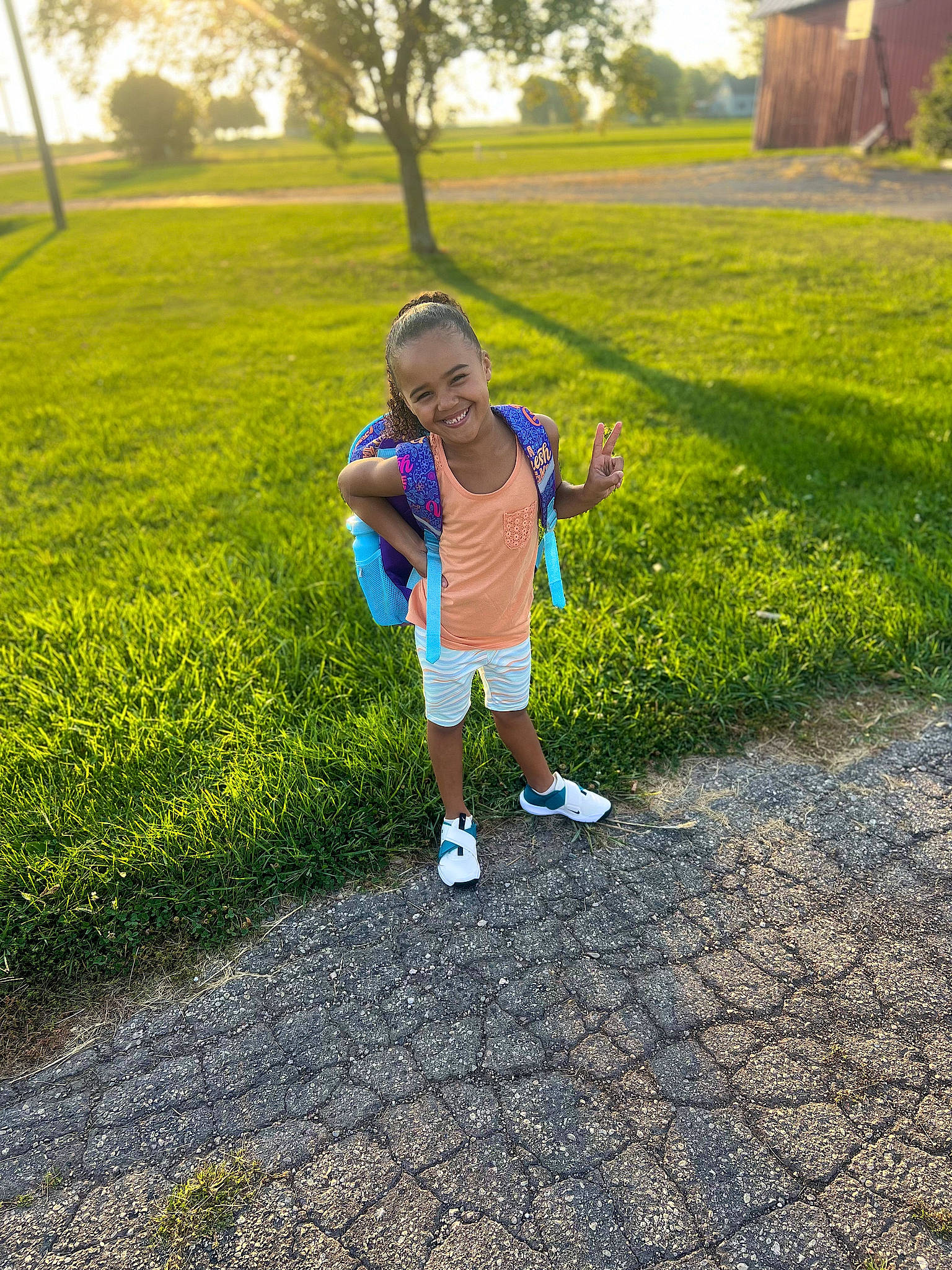 Akiyah is registered to the contest to win money with this photo: asphalt, baby, grass, grass_family, grassland, happy, joy, landscape, leisure, meadow, morning, people_in_nature, person, plant, recreation, shorts, summer, sunlight, toddler, tree