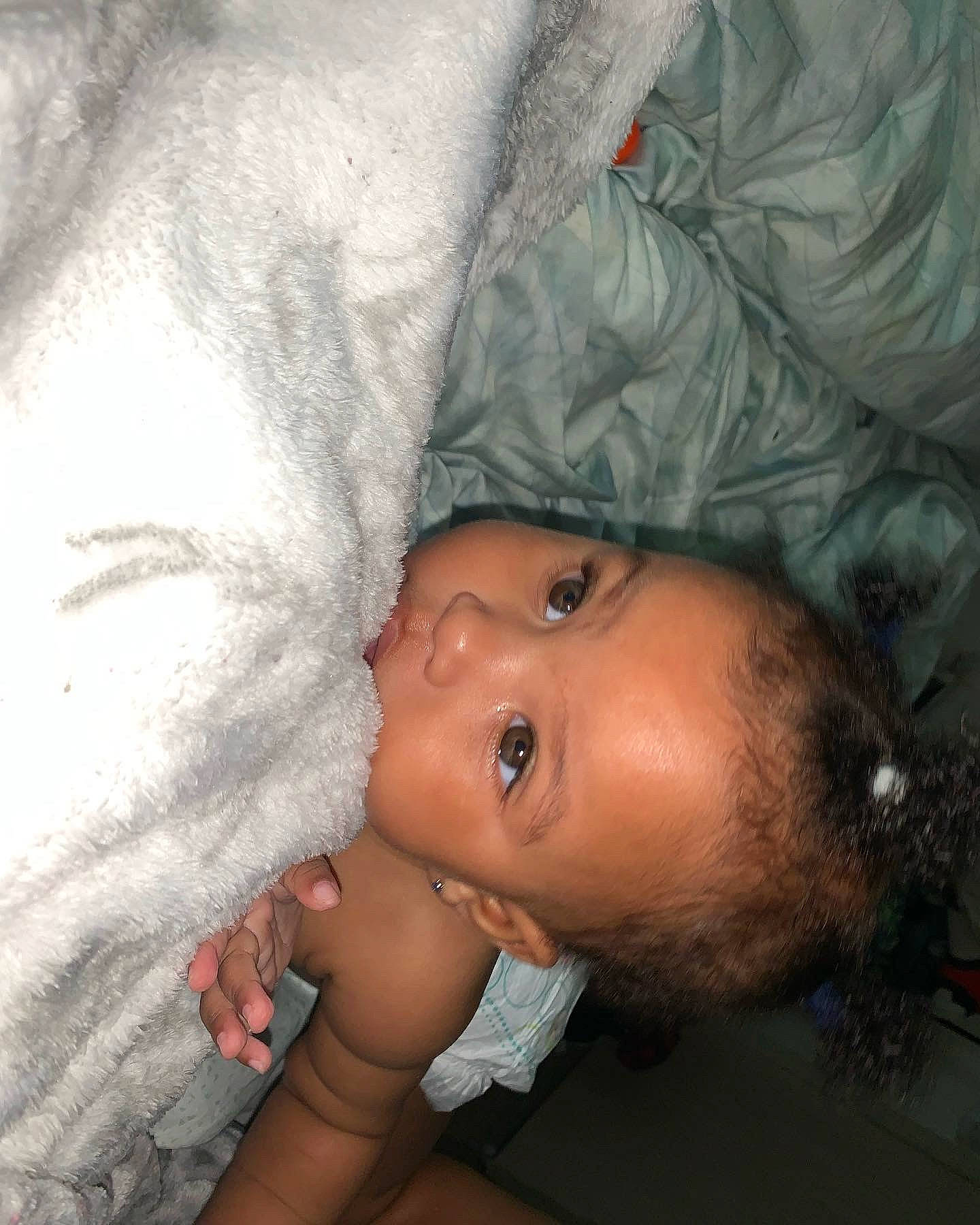 Elani is registered to the contest to win money with this photo: abdomen, arm, baby, barechested, cheek, chest, comfort, eyelash, flash_photography, flesh, fun, gesture, happy, lip, nail, nose, person, room, skin, toddler