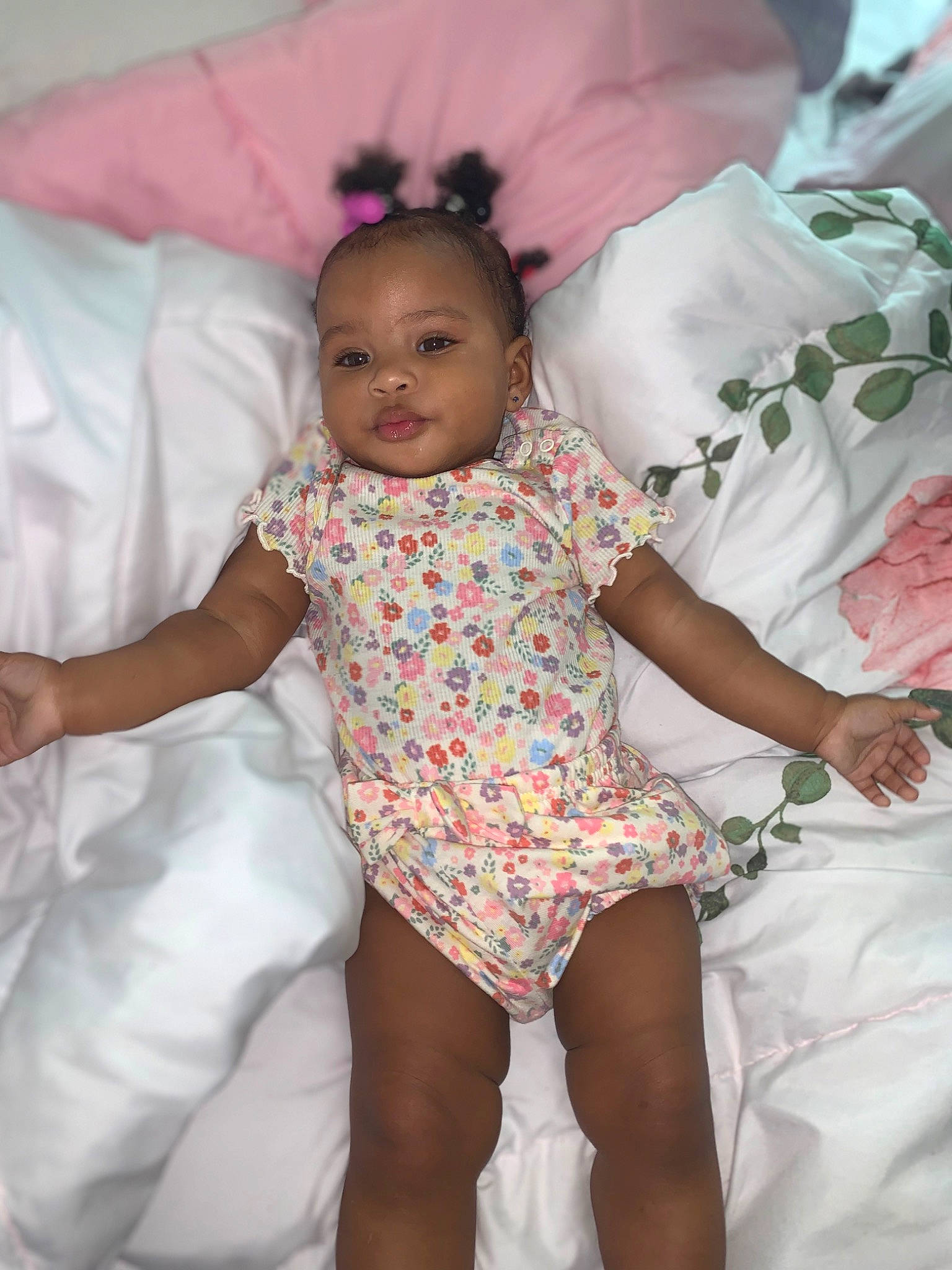 Elani is registered to the contest to win money with this photo: baby, baby_toddler_clothing, child, comfort, facial_expression, finger, fun, happy, human, iris, mouth, people, person, pink, product, skin, smile, textile, thigh, thumb