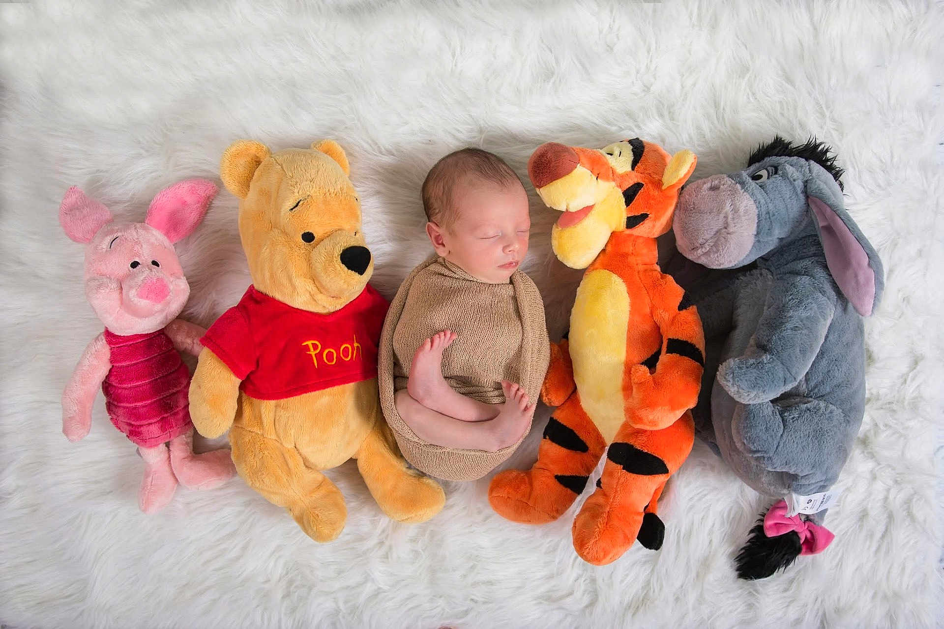 Wyatt joined the competition — help win amazing prizes! newborn, baby, sleeping, swaddled, plush_toy, stuffed_animal, winnie_the_pooh, piglet, tigger, eeyore, soft_rug, white_background, child, cute, cozy, indoors, resting, peaceful, toy_collection, infant