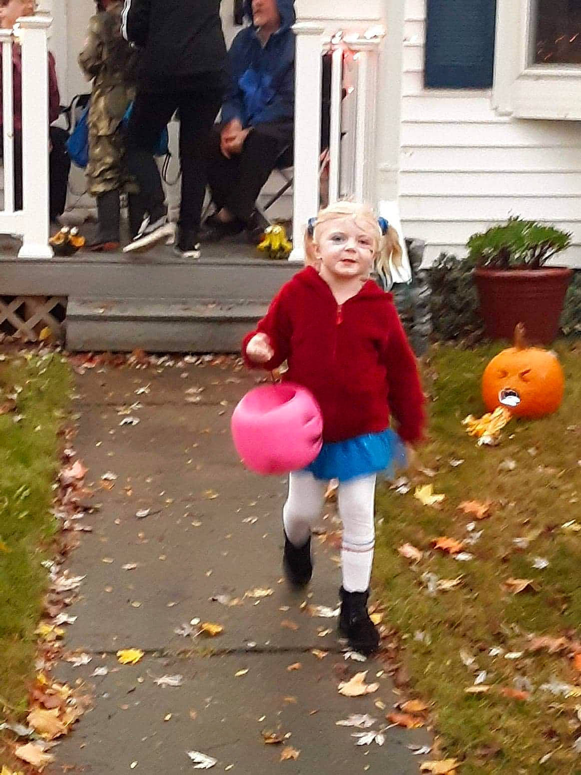 Aveyanah is registered to the contest to win money with this photo: asphalt, blurred, boot, calabaza, child, event, fun, happy, jacket, leg, leisure, orange, people_in_nature, person, plant, pumpkin, road_surface, shoe, sidewalk, sneakers