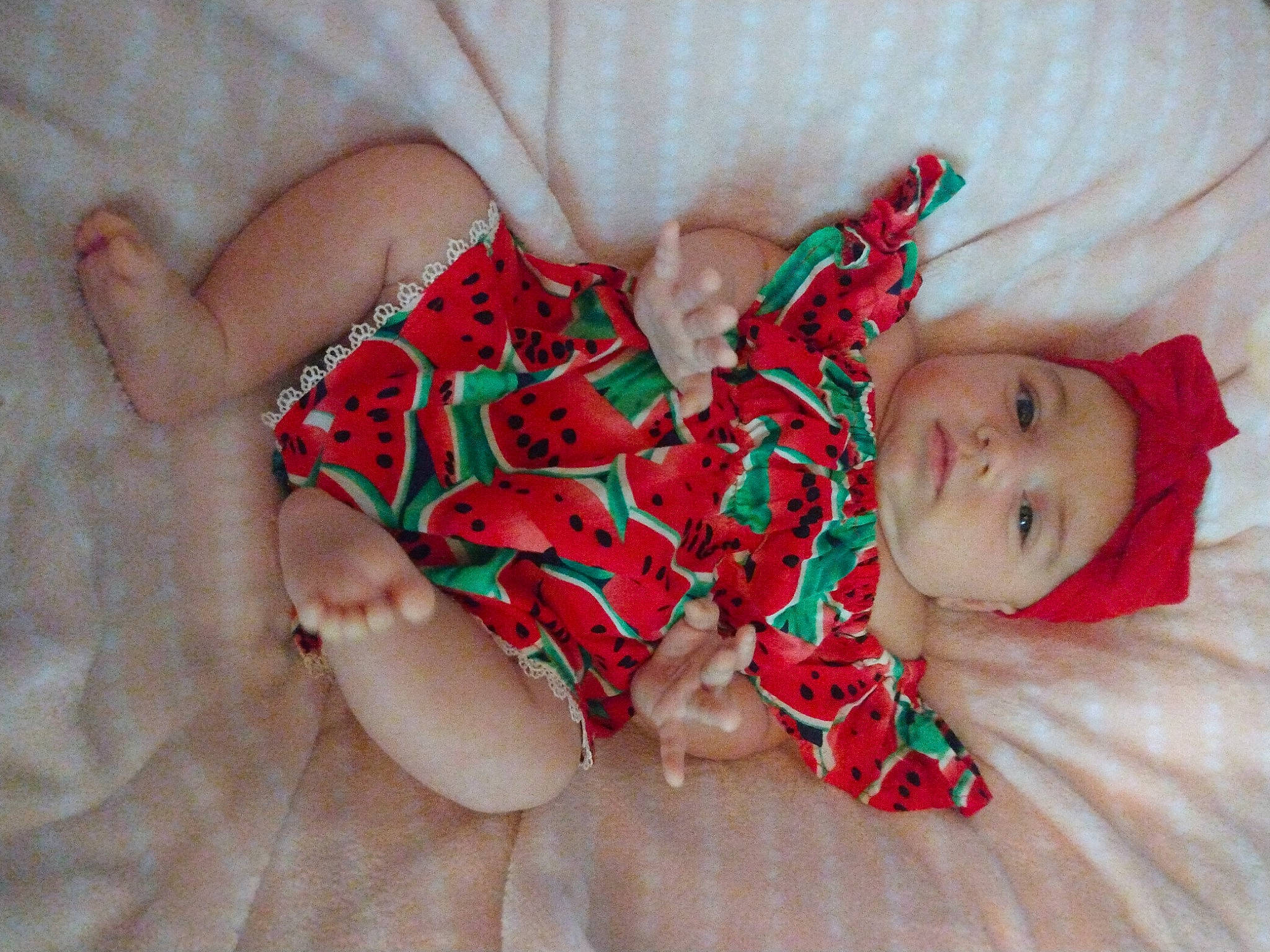 A'Riyah is registered to the contest to win money with this photo: baby, baby_toddler_clothing, barefoot, child, comfort, finger, flooring, foot, happy, headwear, human_body, human_leg, leg, linens, nail, pattern, person, pink, skin, thigh