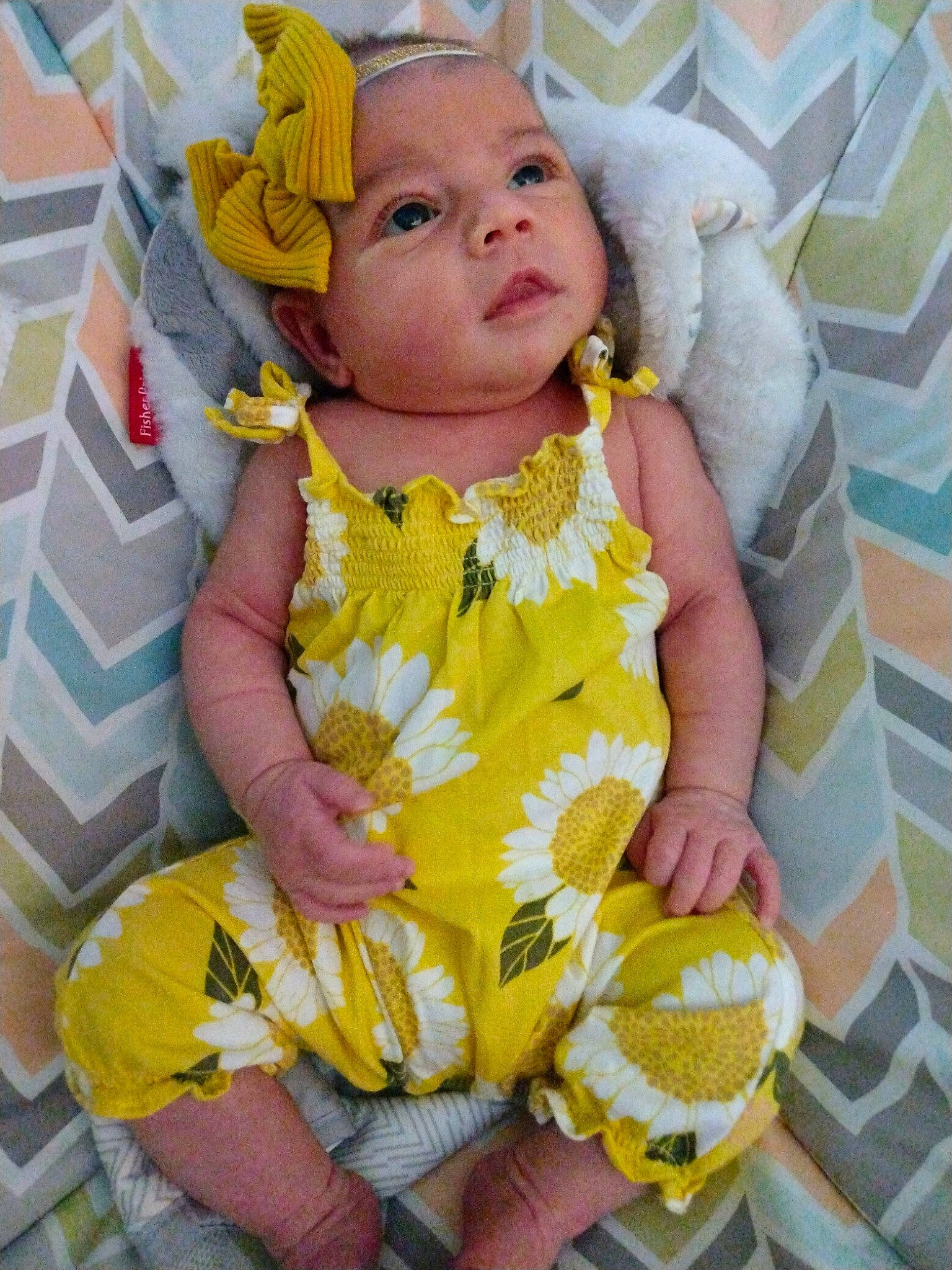 A'Riyah is registered to the contest to win money with this photo: baby, baby_products, baby_safety, baby_sleeping, baby_toddler_clothing, cheek, child, comfort, eye, face, grass, happy, head, headwear, linens, pattern, person, sitting, skin, sleeve