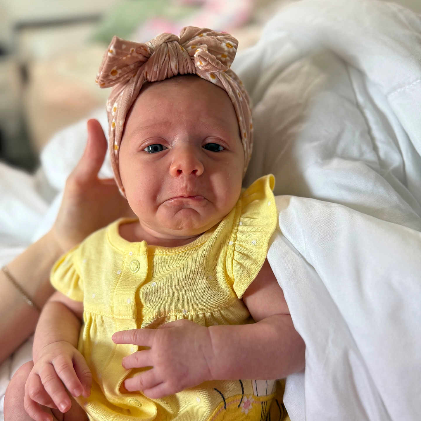 Jovie is registered to the contest to win money with this photo: architecture, baby, bodypart, bonnet, building, clothing, couch, face, finger, furniture, hand, happy, hat, head, hospital, newborn, person, photography, portrait, smile