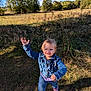 Joaleen is registered to the contest to win money with this photo: child, toddler, denim_jacket, jeans, pink_shoes, outdoor, field, grass, trees, blue_sky, sunny, smiling, waving, happy, nature, daylight, casual_clothing, young_child, person, playful