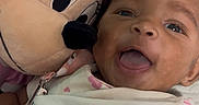 Lyric is registered to the contest to win money with this photo: adorable, baby, butterfly_print, child, closeup, cuddling, cute, face, happy, indoor, infant, lying_down, minnie_mouse, onesie, person, pink_bow, plush_toy, smile, soft_toy, toy