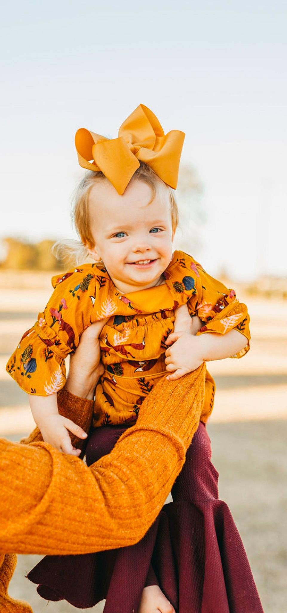 Aspen is registered to the contest to win money with this photo: baby, baby_toddler_clothing, child, costume, costume_hat, event, eye, fun, fur, happy, hat, joy, orange, pattern, peach, people_in_nature, person, portrait_photography, sitting, sleeve