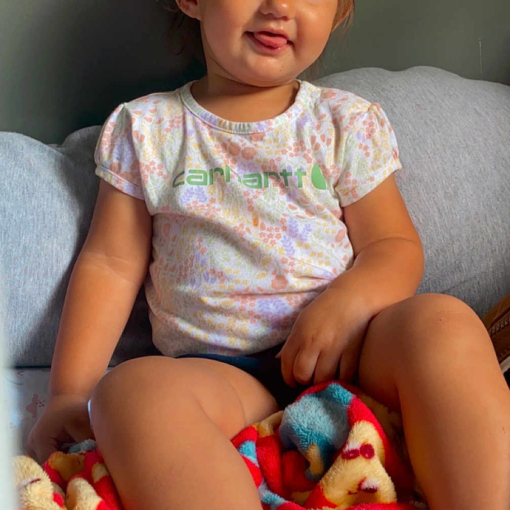 Ava joined the competition — help win amazing prizes! baby, bodypart, clothing, couch, cushion, face, finger, furniture, hand, happy, head, homedecor, hosiery, person, photography, portrait, shorts, sitting, smile, t_shirt